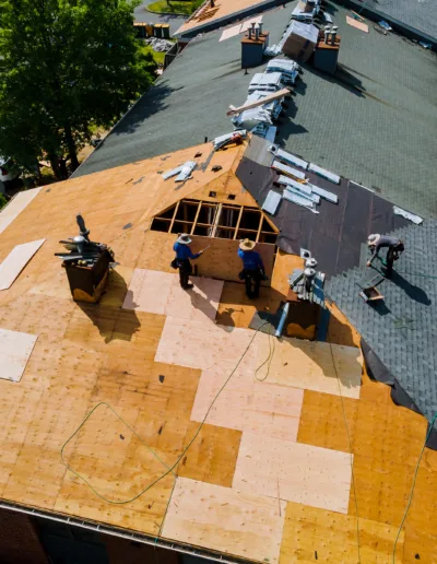 An aerial view of a roof being re-roofed.